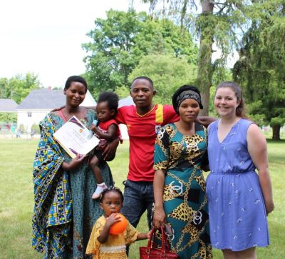 Courtney Good with clients at World Refugee Day