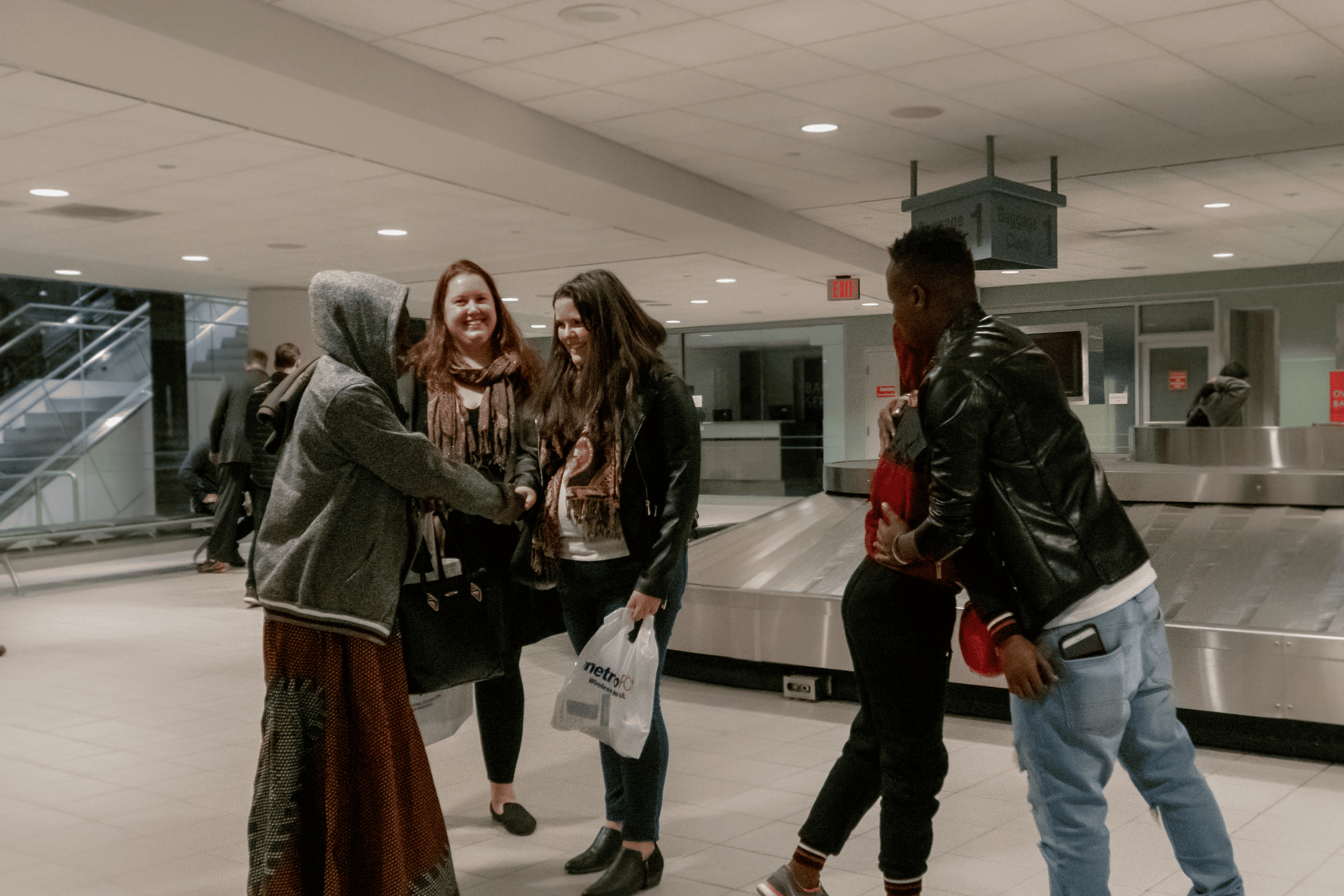 Families embrace at the airport